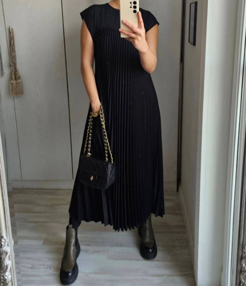 Elegant women's summer maxi dress. Pleated skirt, cap sleeves, comfortable empire waist for all-day wear.