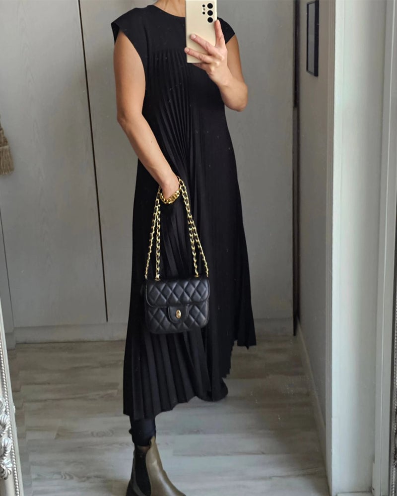 Modest yet stylish women's pleated maxi dress, with cap sleeves & flattering empire waist detail.