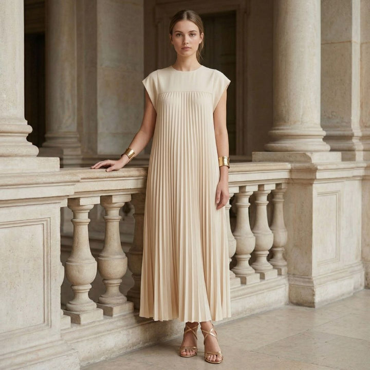 Women's formal pleated maxi dress, featuring modest cap sleeves & a flattering empire waist. Event wear.