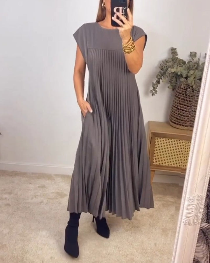 Modest women's pleated maxi dress. Extended cap sleeves, empire waist. Elegant formal wear.