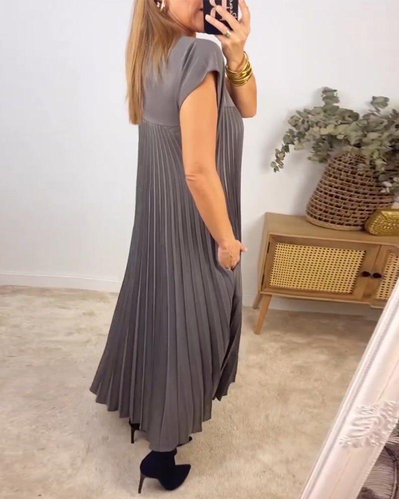 Pleated maxi dress for women, featuring modest cap sleeves and an elegant empire waistline design.