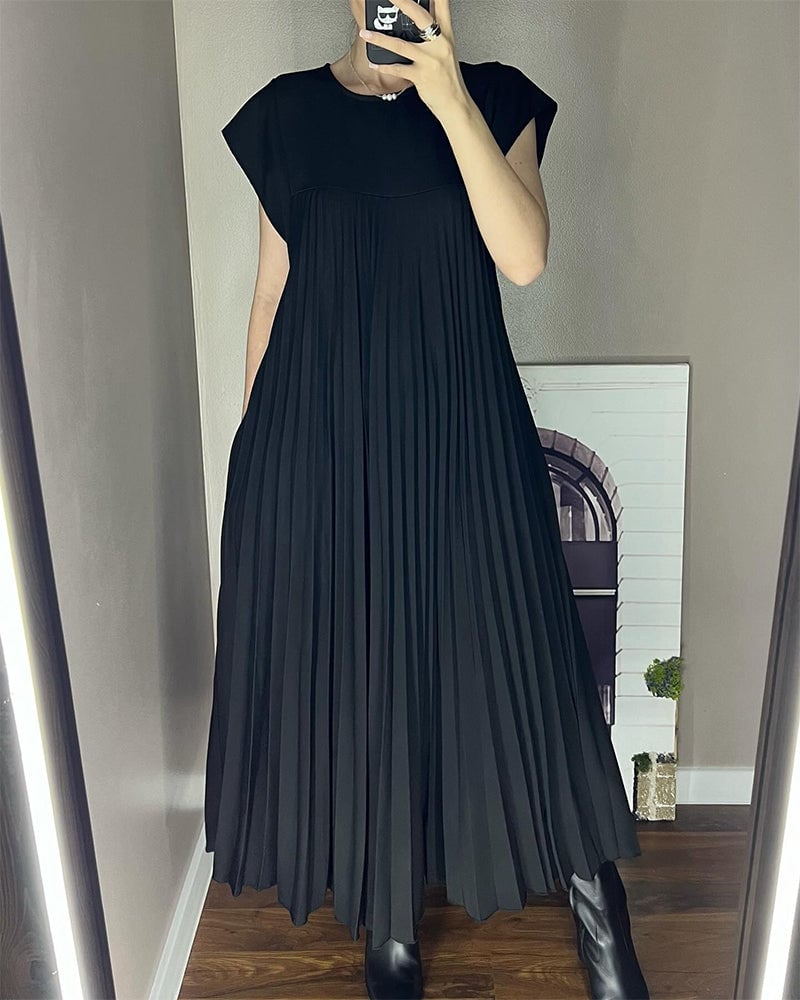 Stylish women's long dress: pleated, with extended cap sleeves and a relaxed empire waist silhouette.