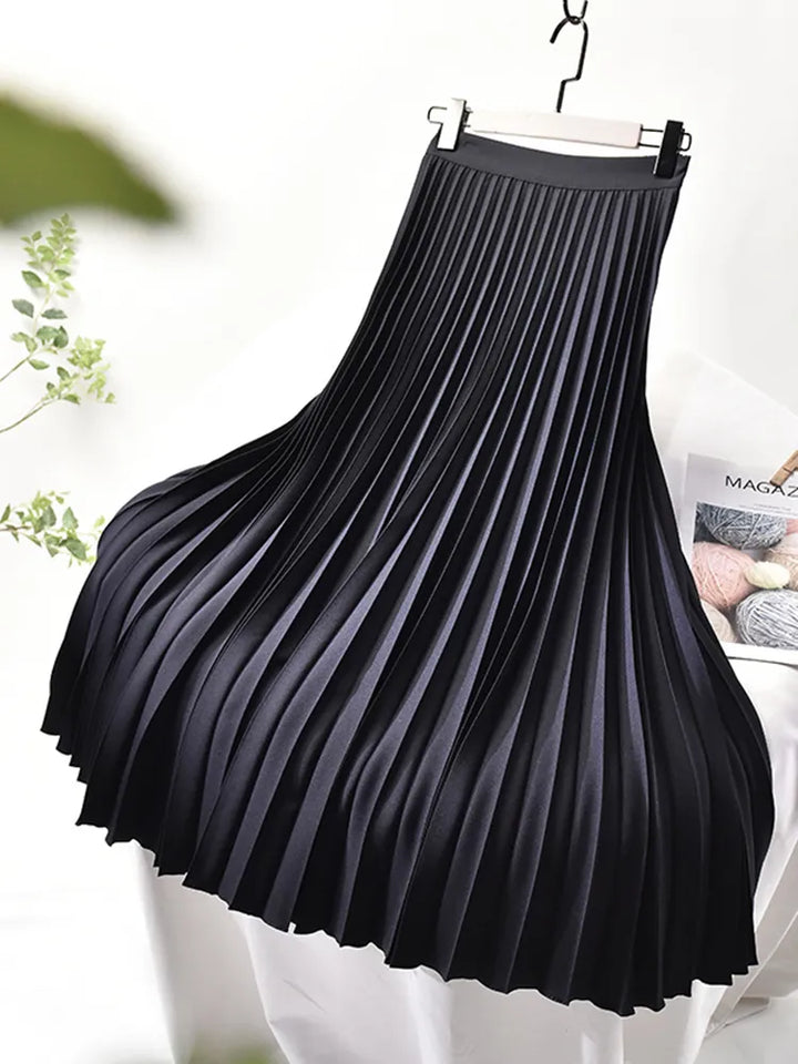 Flowy women's pleated maxi skirt in a vibrant blue, ideal for elegant and casual spring outfits