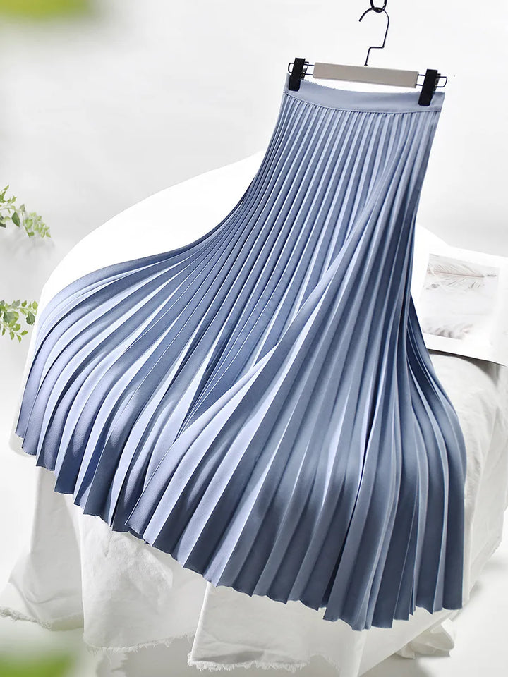 Back view of a women's pleated maxi skirt in a rich burgundy, highlighting its elegant and flowy design