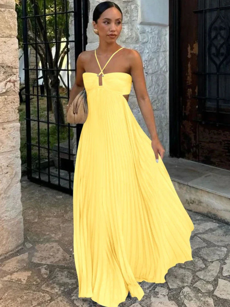 Elegant women's pleated maxi wedding guest dress. Sleeveless, formal, perfect for special occasions.