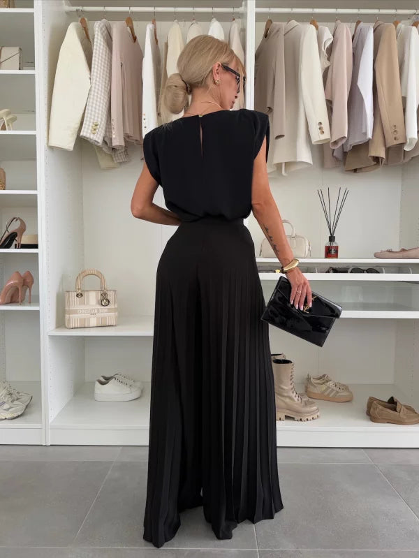 Women's matching pleated top and wide-leg trousers set, perfect for versatile, elegant fashion.