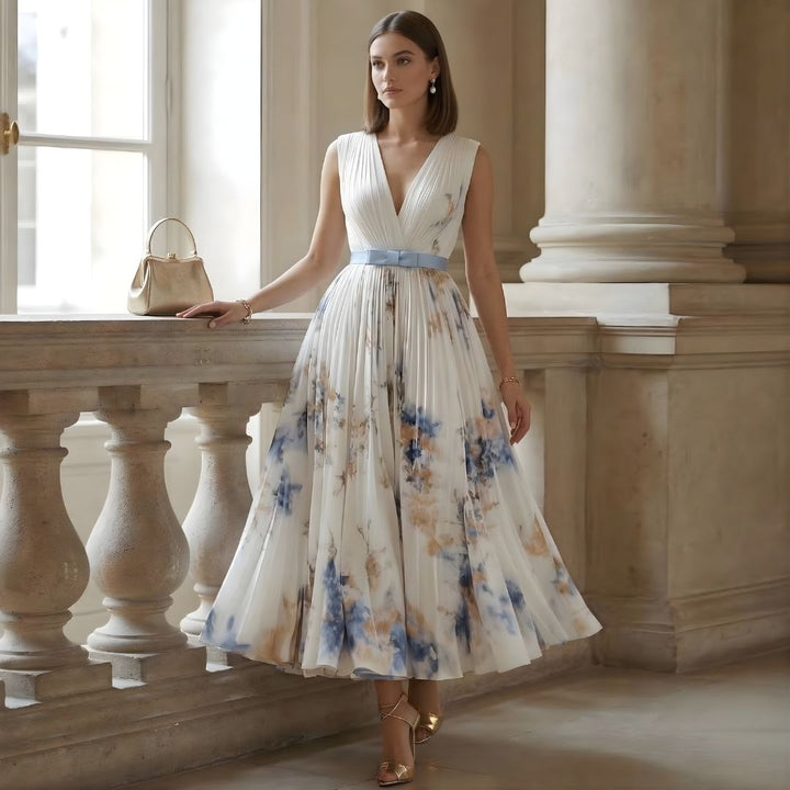 Formal evening gown with a flattering V-neck, pleated skirt & cinched waist. A beautiful party dress.