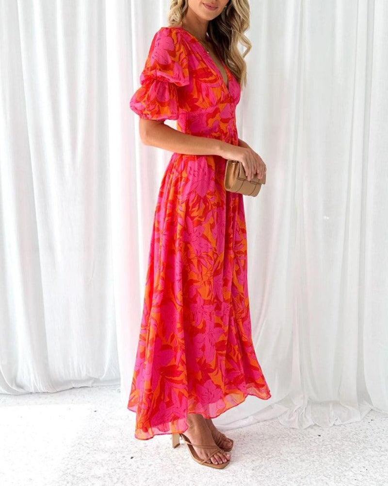 Flowy women's V-neck maxi dress with all-over print & puffed sleeves, ideal for elegant summer fashion.