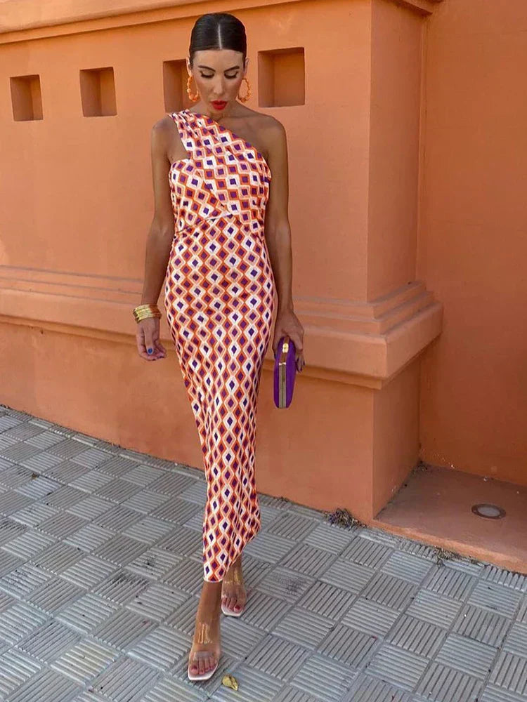 Elegant women's printed one-shoulder maxi dress with floral pattern, perfect for a summer party.