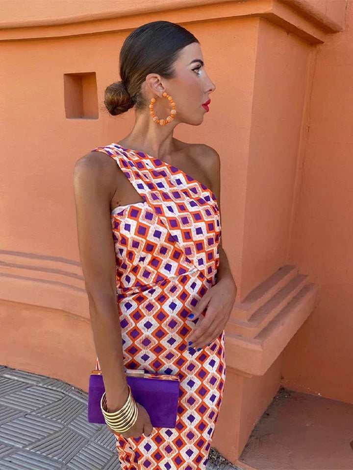 Maxi dress for women featuring a stylish one-shoulder design and vibrant floral print.
