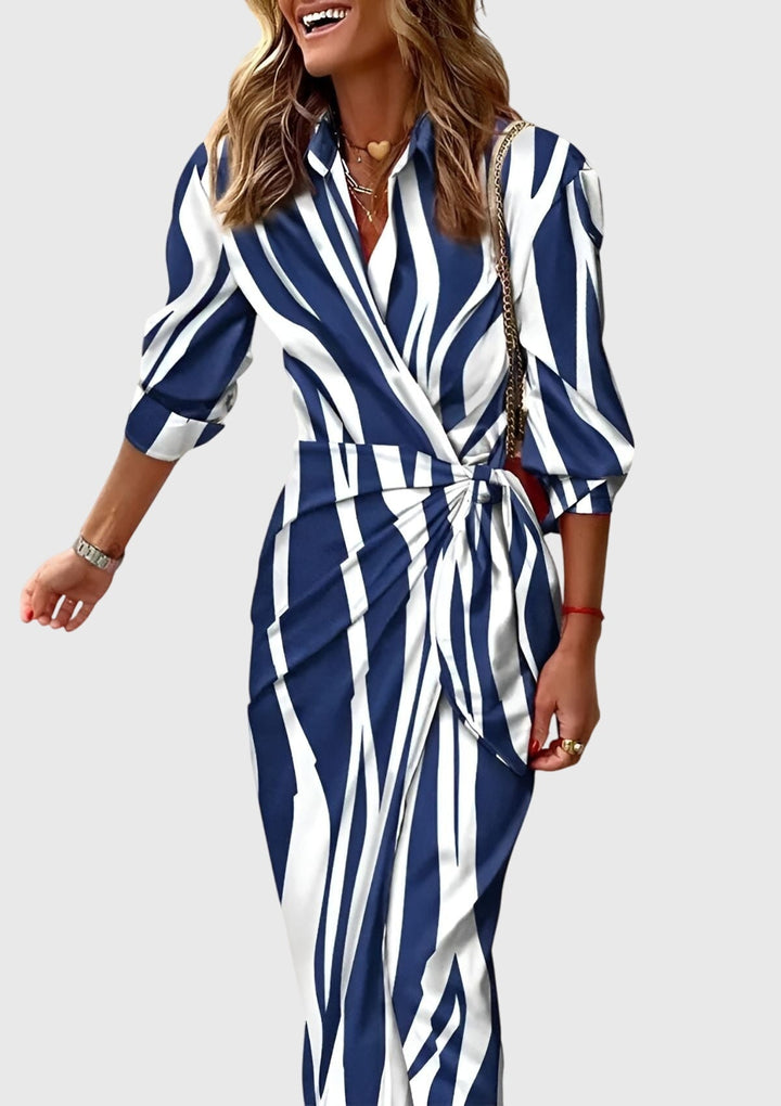 Model showcasing elegant women's printed wrap dress, a flattering long style for fashion.