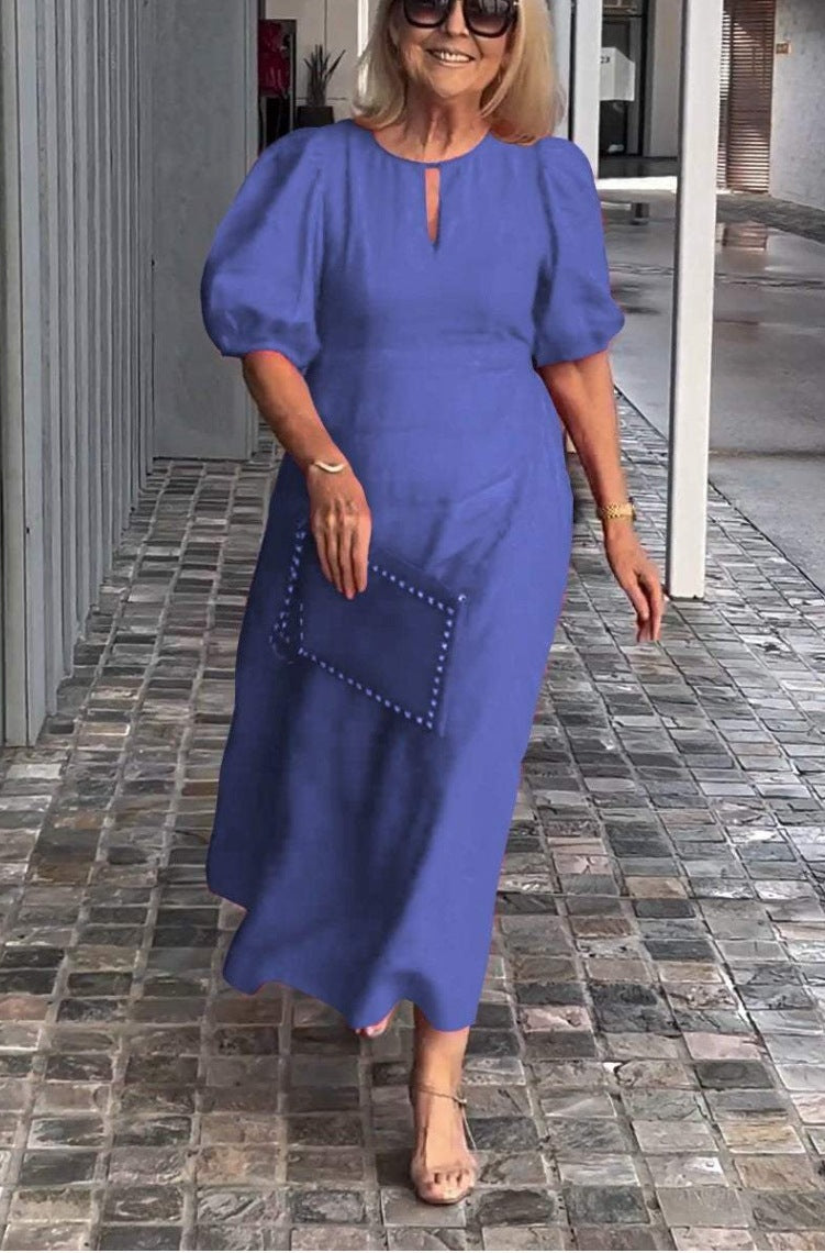 Formal women's puff-sleeve midi dress, offering an elegant and timeless look for special occasions.