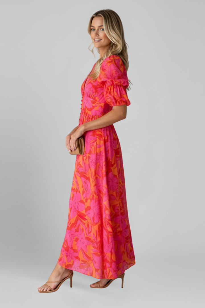 Beautiful red printed V-neck maxi dress for women, featuring trendy puff sleeves and a comfortable, flowy design.