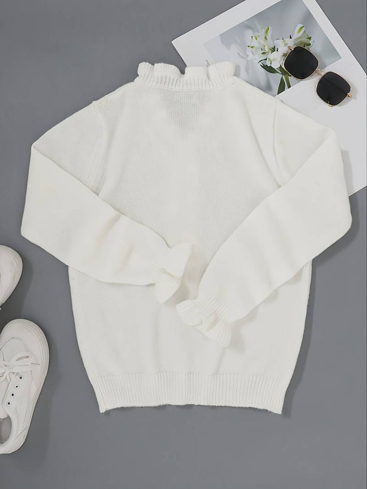 Long sleeve women's ruffle blouse featuring stylish decorative buttons on the front.