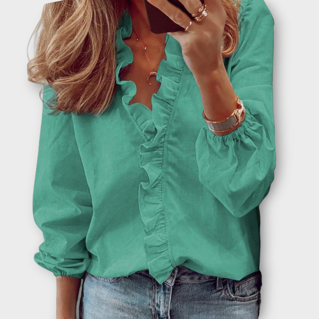 Chic women's ruffled elegant summer blouse for sophisticated fashion. Lightweight and comfortable for office or casual wear.
