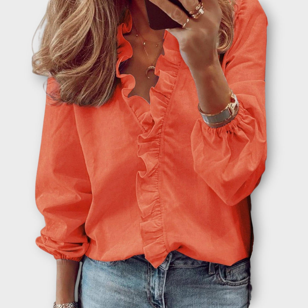 Lightweight women's ruffled top, an elegant summer blouse for sophisticated style. Perfect for versatile office or casual chic.