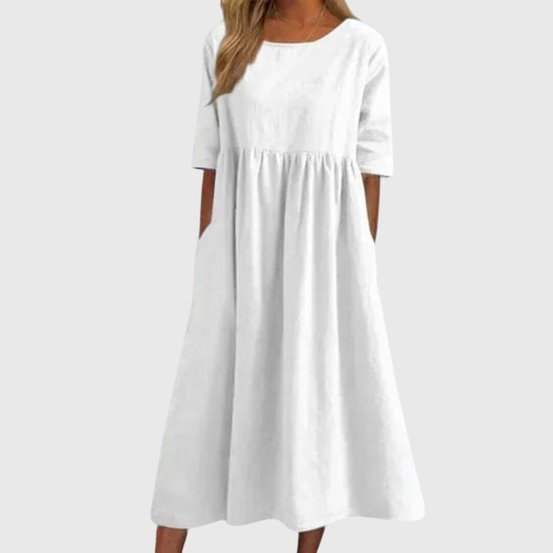 Elegant women's short-sleeve dress, perfect for any occasion. Flattering and chic day to night style.