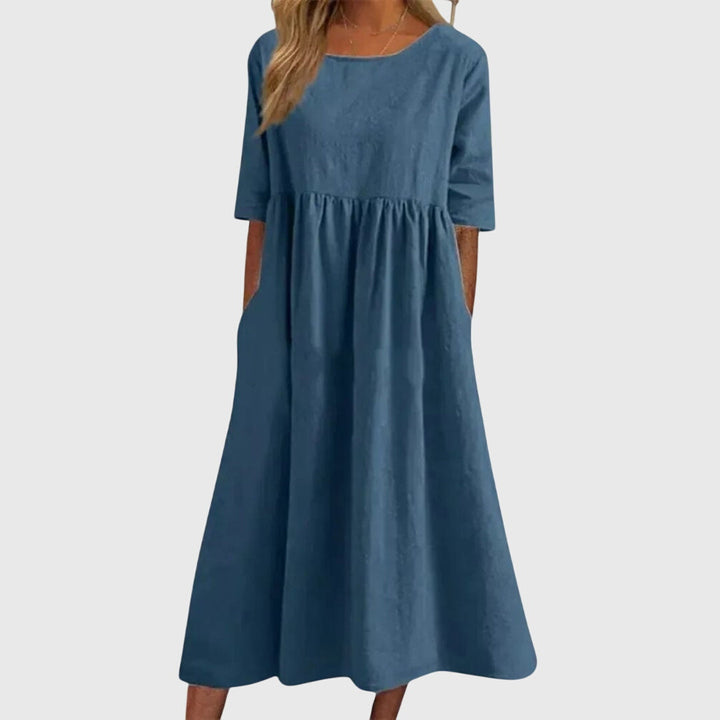 Flattering women's short-sleeve summer dress. Elegant yet casual, perfect for day to night fashion. Chic and versatile.