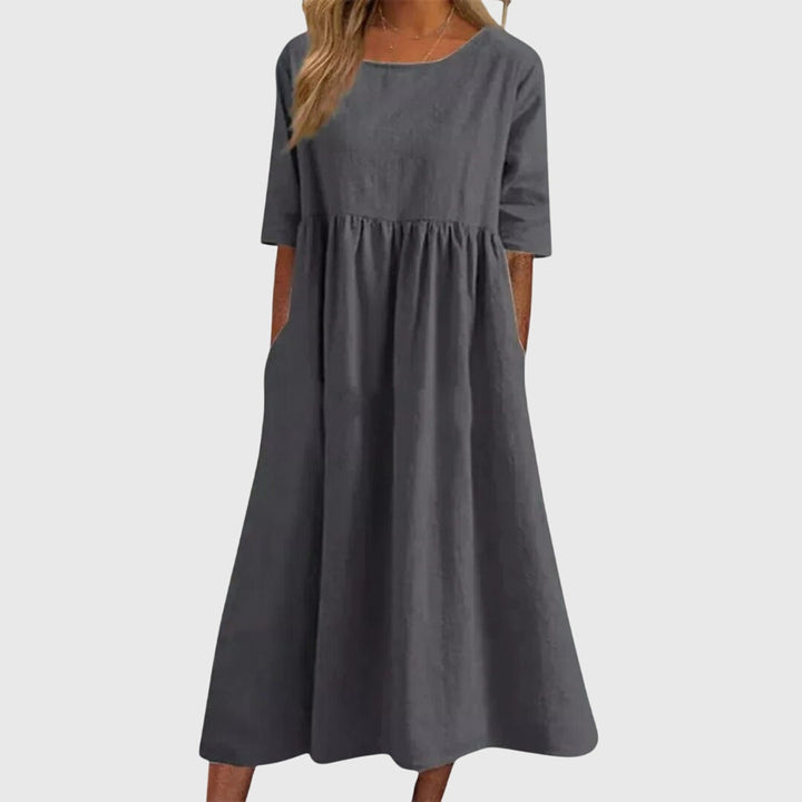 Modern women's short-sleeve fashion dress. Elegant and versatile for any occasion, offering a flattering chic summer style.