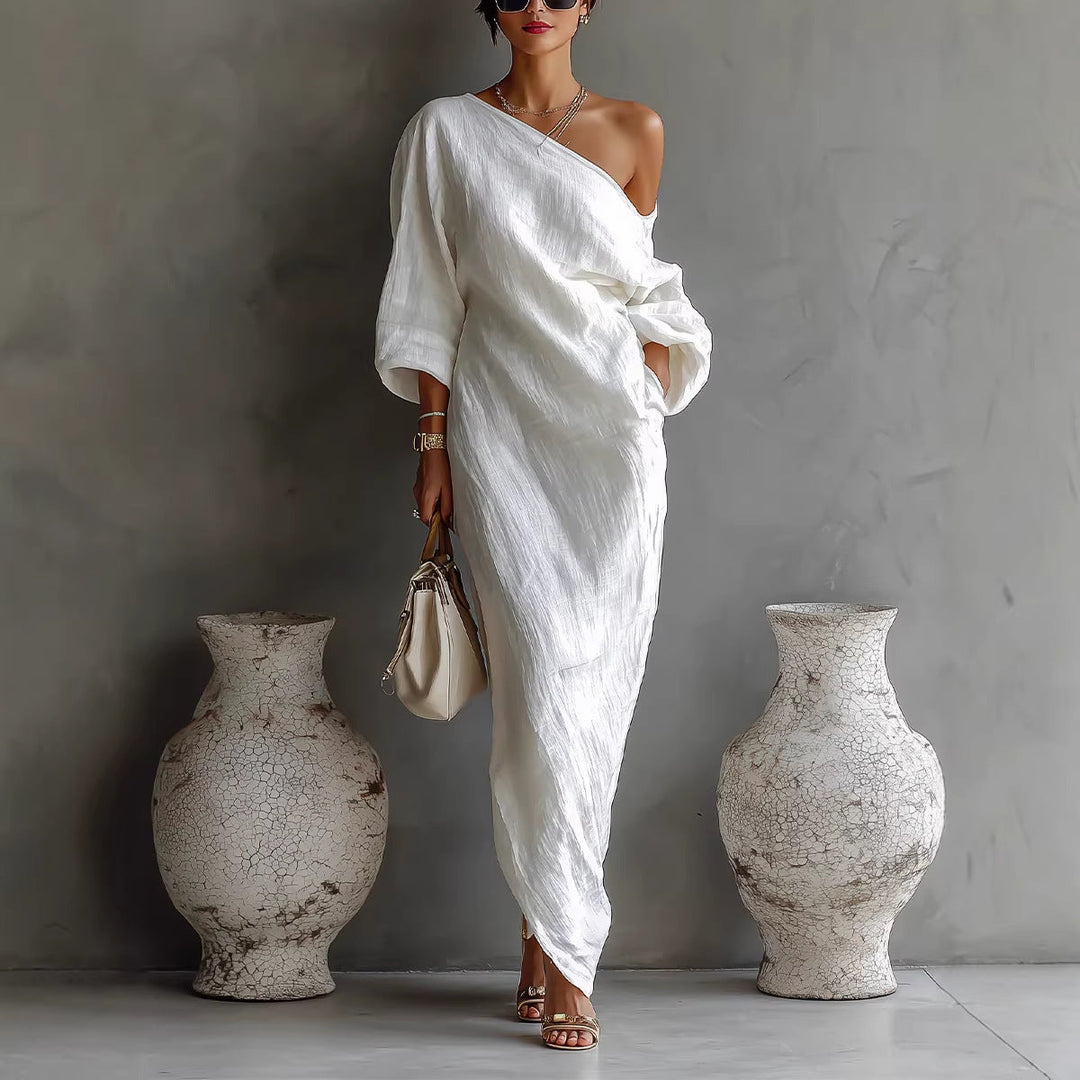 Loose fit elegant women's maxi dress with a unique slanted neck and full lantern sleeves for comfort.