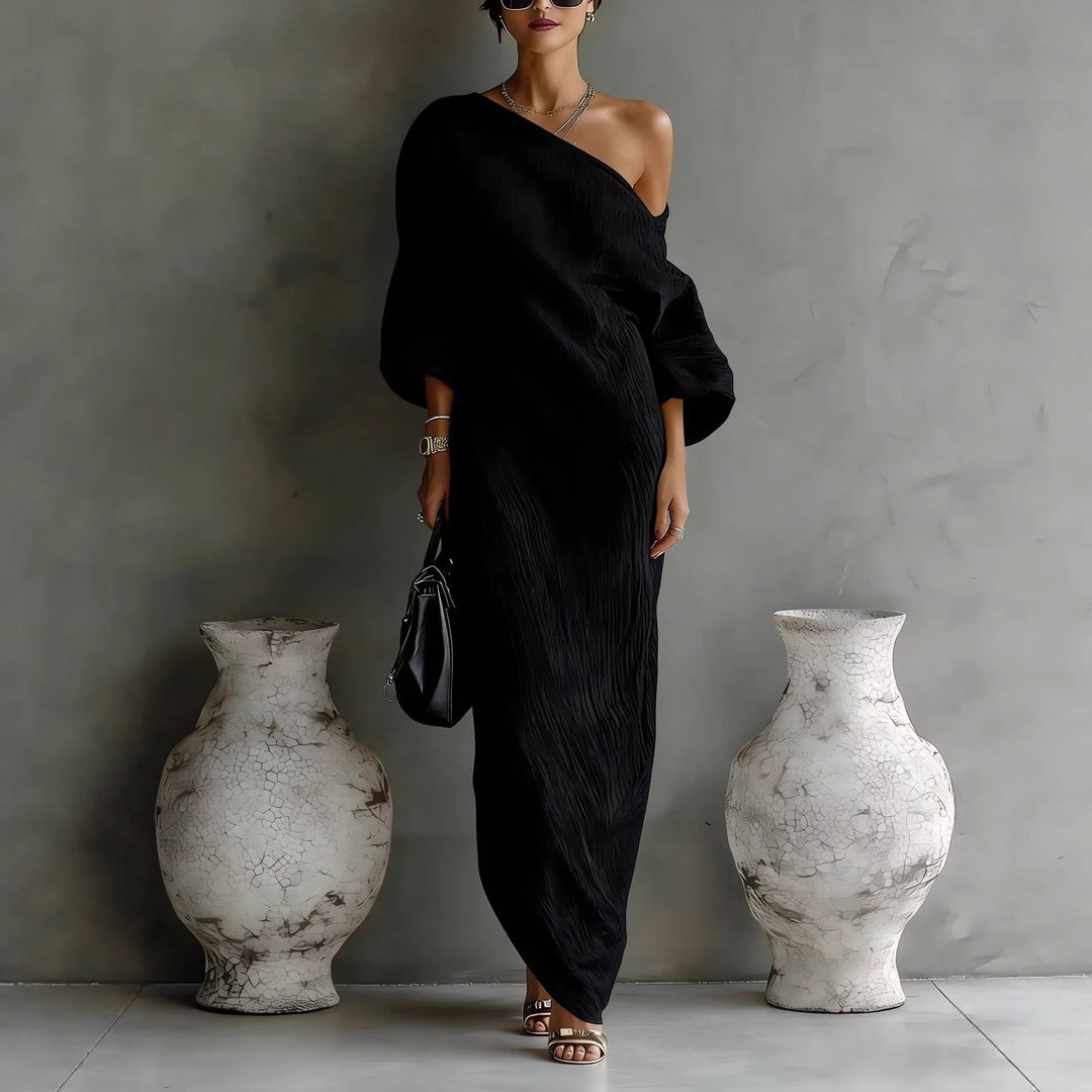 Textured pullover women's maxi dress featuring an elegant slanted neck and flowing lantern sleeves.