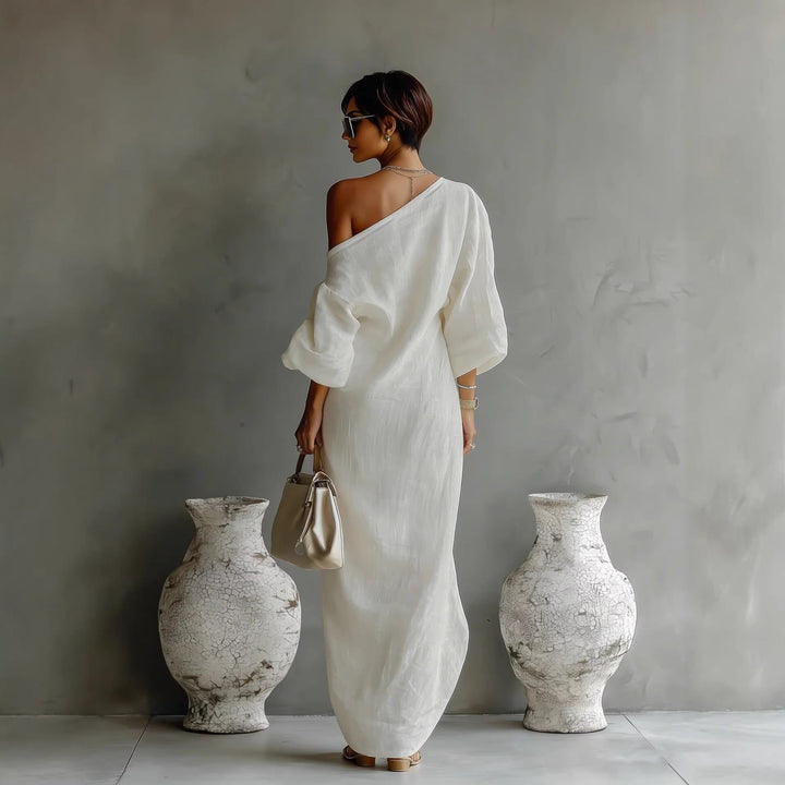 Versatile women's elegant yet casual maxi dress. Features a flattering slanted neck and lantern sleeves.