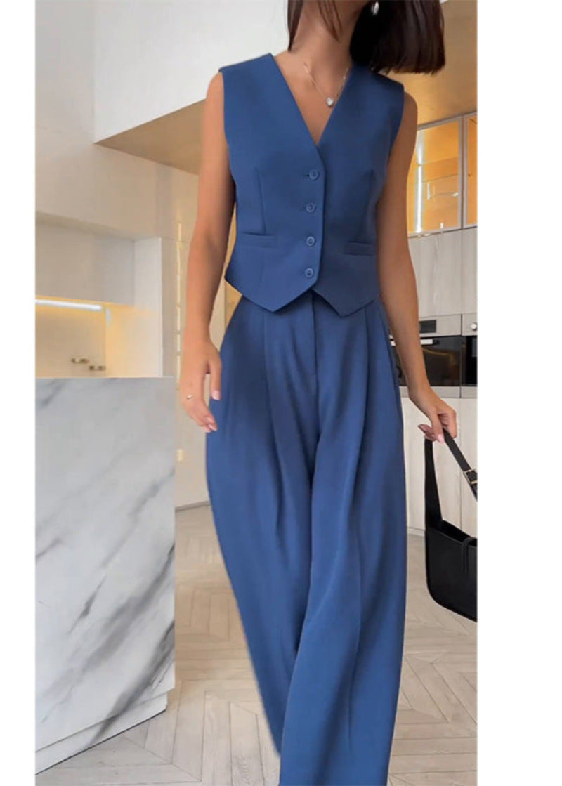 Modern women's elegant sleeveless blazer and slim trousers set for a sophisticated, professional look.
