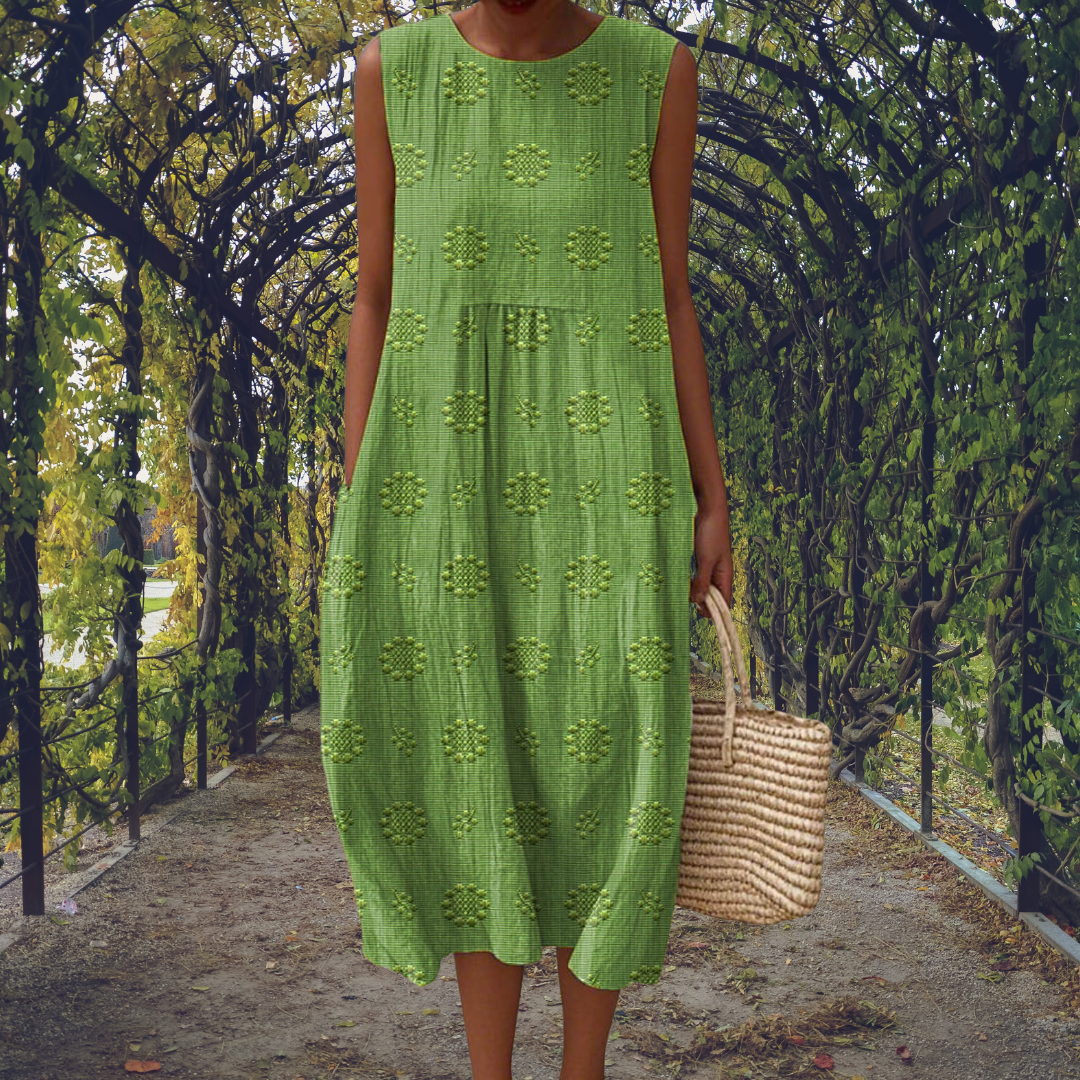 Elegant women's sleeveless midi dress, flowy textured fabric, round neck, perfect for summer casual wear.