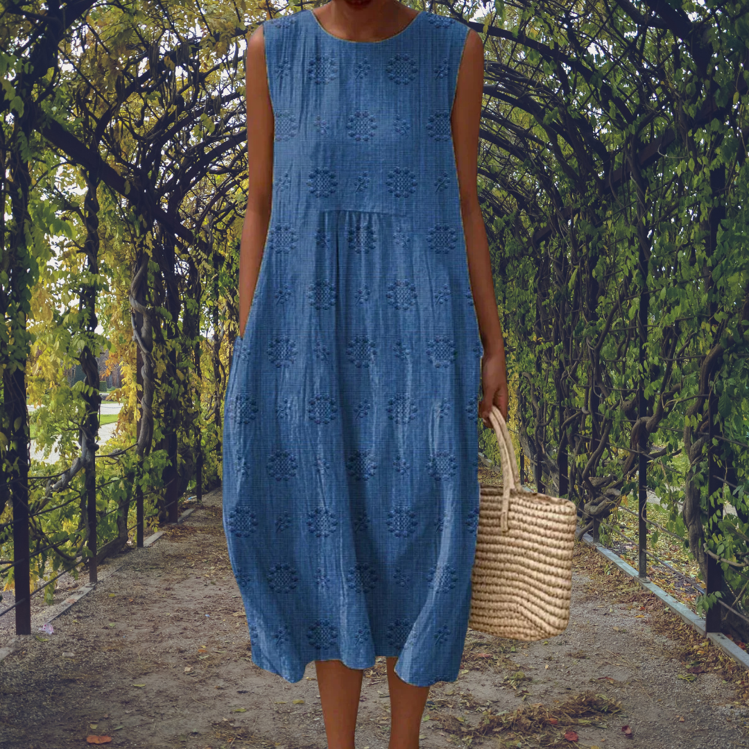 Chic women's sleeveless midi dress for summer. Elegant day dress with a comfortable, flowy design & round neck.
