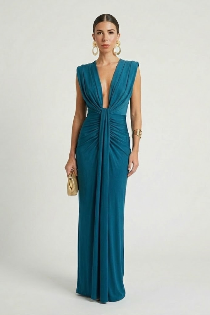 Flowing pleats on an elegant women's maxi dress, showcasing texture and movement.