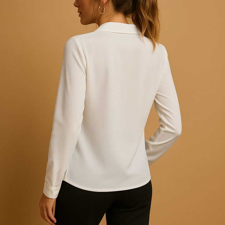 Model wearing an elegant women's solid blouse, a comfortable and versatile top for a chic business casual look.