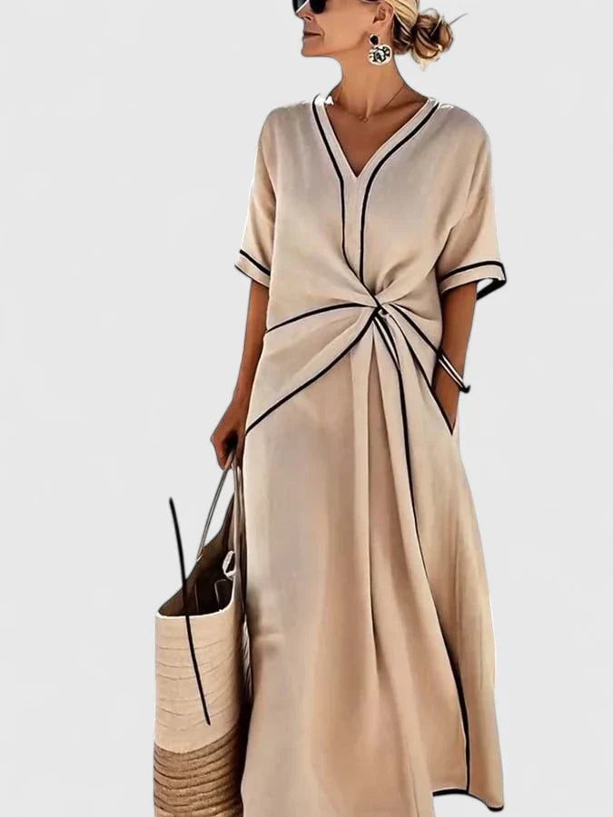 Stylish women's striped summer midi dress. Effortless short sleeve design, perfect for a chic casual or elegant vacation look.