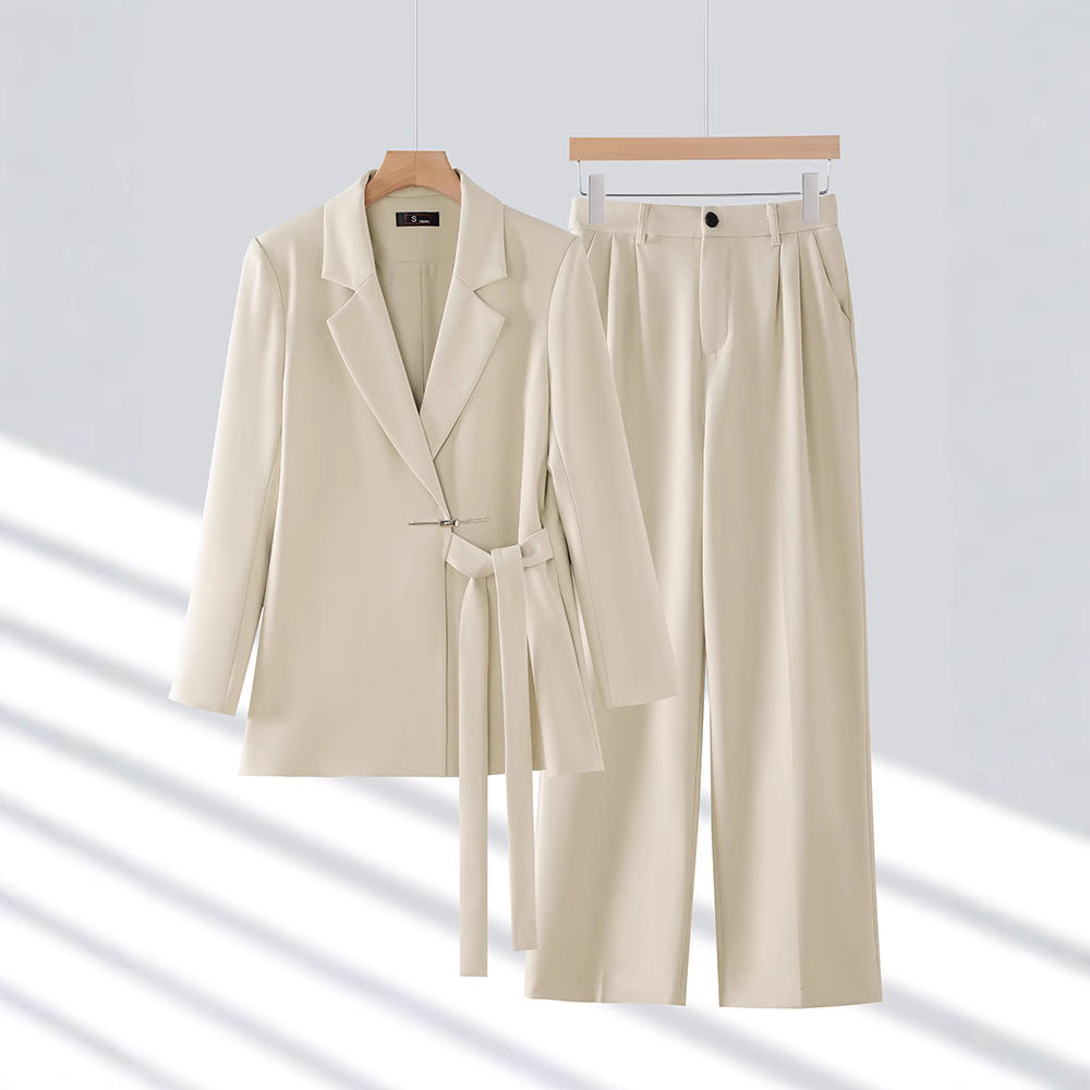 Stylish women's long blazer and matching tailored trousers set, ideal for elegant formal wear