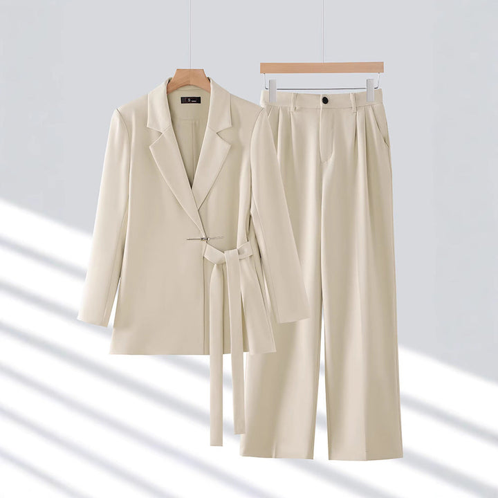 Stylish women's long blazer and matching tailored trousers set, ideal for elegant formal wear