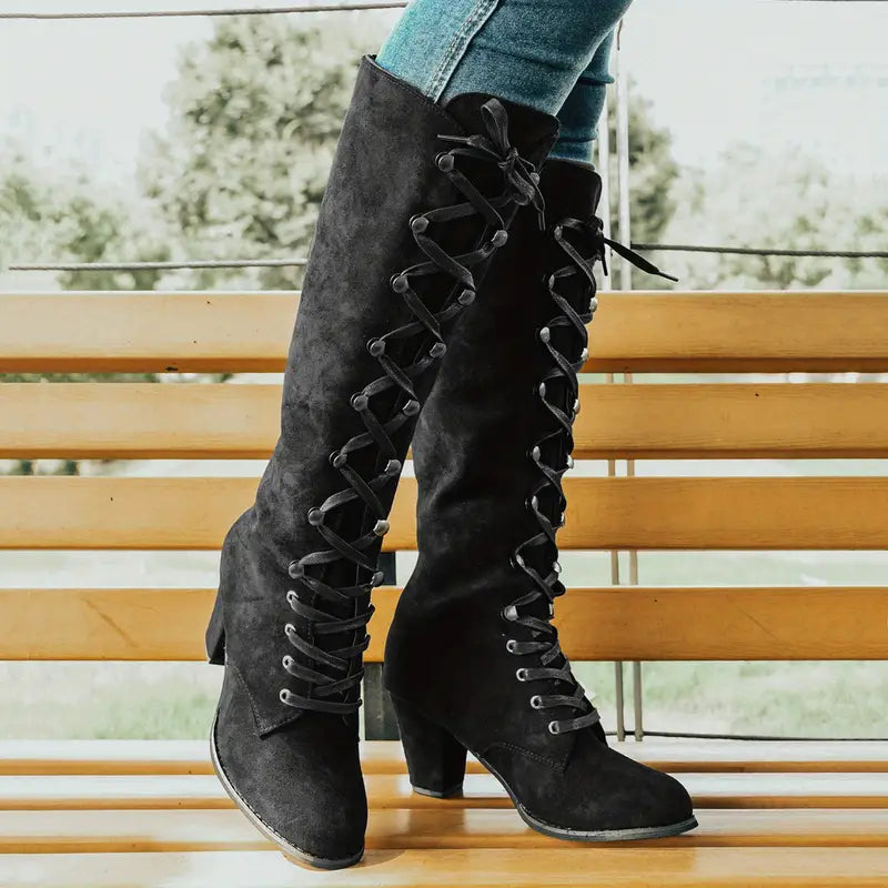 Stylish women's tall boots with a sturdy block heel and prominent lace-up detailing