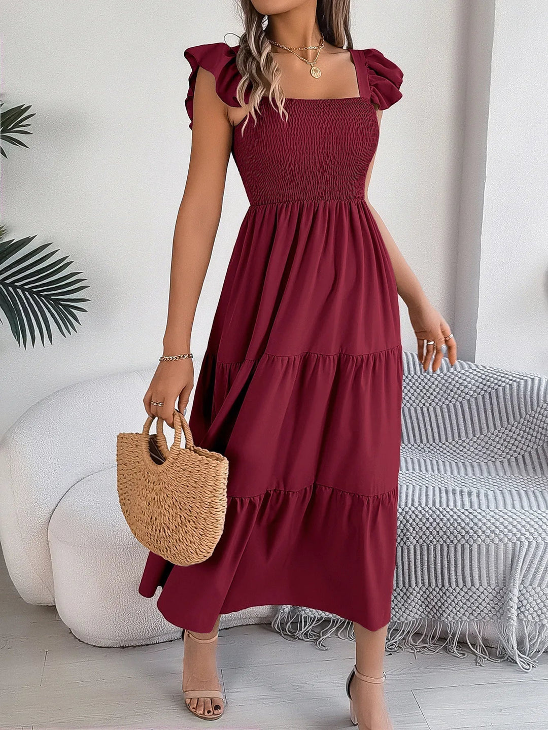 Versatile women's midi tiered dress for summer fashion. Flowy & elegant, suitable for various occasions.