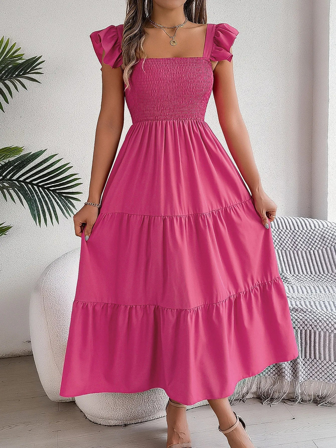 Flowy women's elegant tiered midi dress for a comfortable yet chic look. Perfect for spring outings.