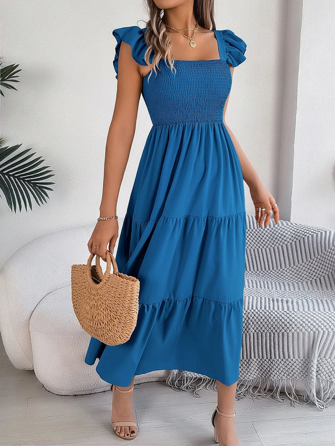 Stylish women's tiered midi dress, an elegant choice for spring and summer occasion wear. Casual chic.