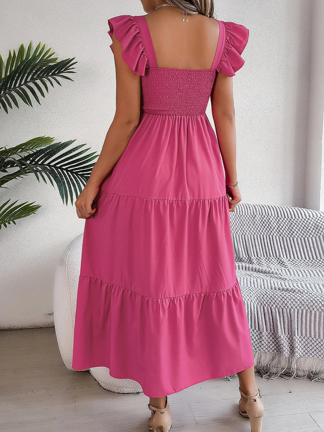 Elegant women's tiered midi dress. Flowy, smocked, & ruffled, ideal for spring/summer casual chic.