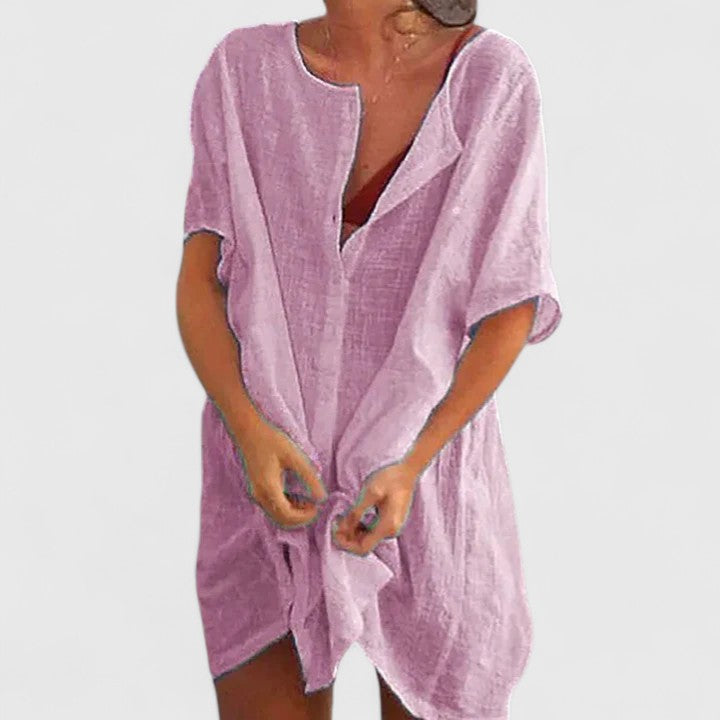 Flowy women's summer tunic dress, comfortable and versatile. Ideal for warm weather and elegant daily wear.