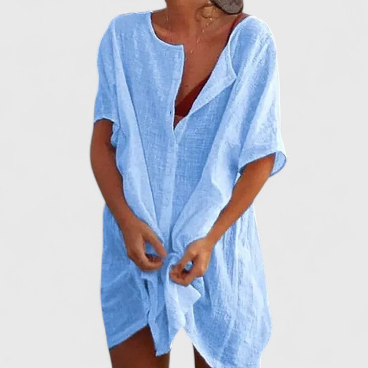Casual women's elegant tunic dress. Lightweight fabric, stylish design for summer comfort and fashion.