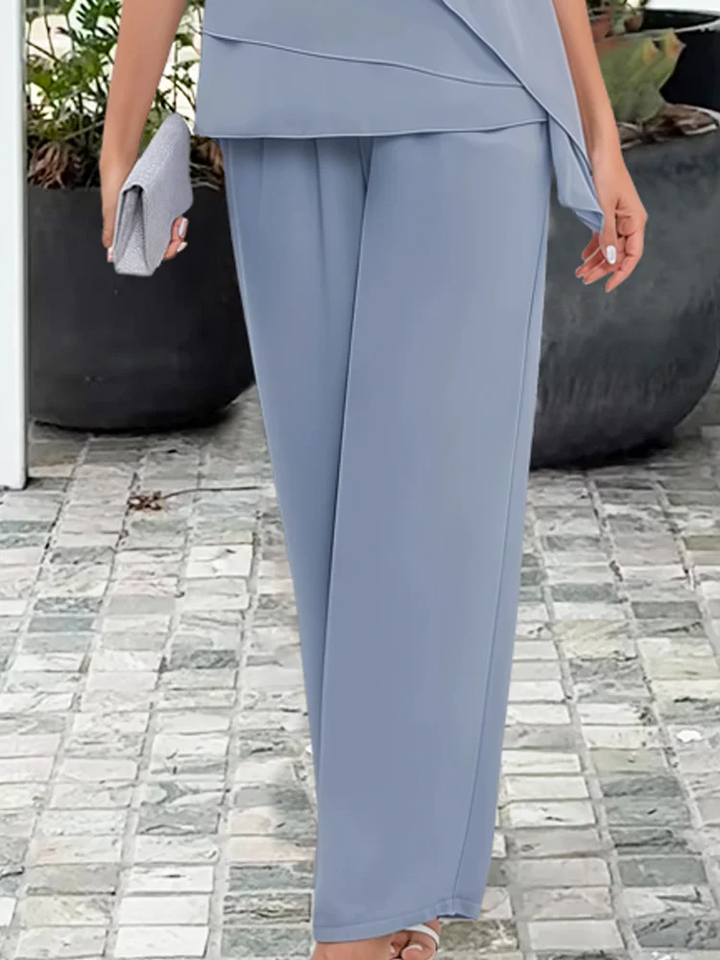 Comfortable & elegant women's cape top and trouser set, perfect formal outfit for any special event.