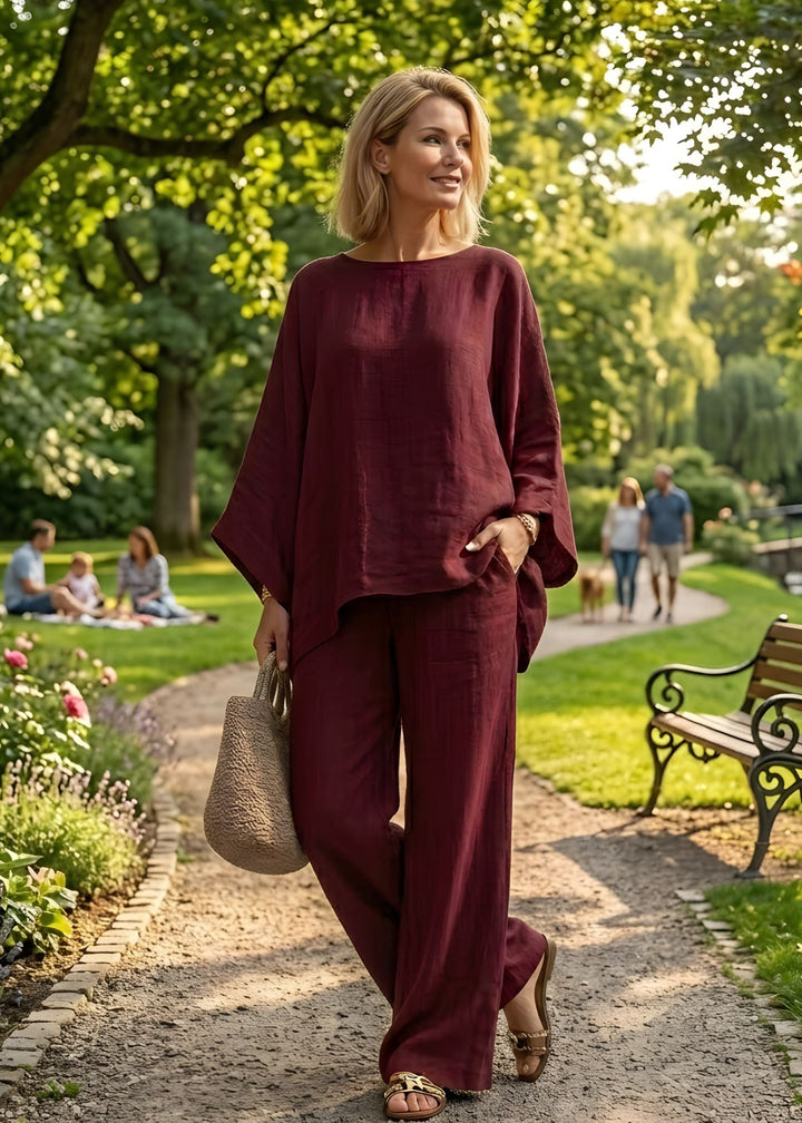 Casual chic women's two-piece set with a relaxed cape top and flattering wide-leg pants, ideal for summer style.