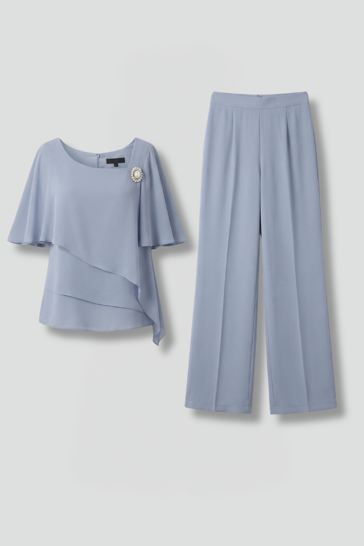 Elegant women's two-piece set with a chic layered top and comfortable straight leg trousers, perfect for summer.