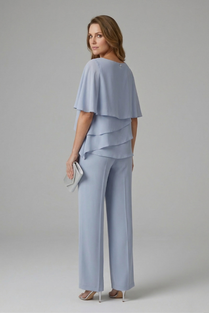 Stylish women's layered top and straight leg trousers set. Elegant two-piece outfit for chic summer casual fashion.