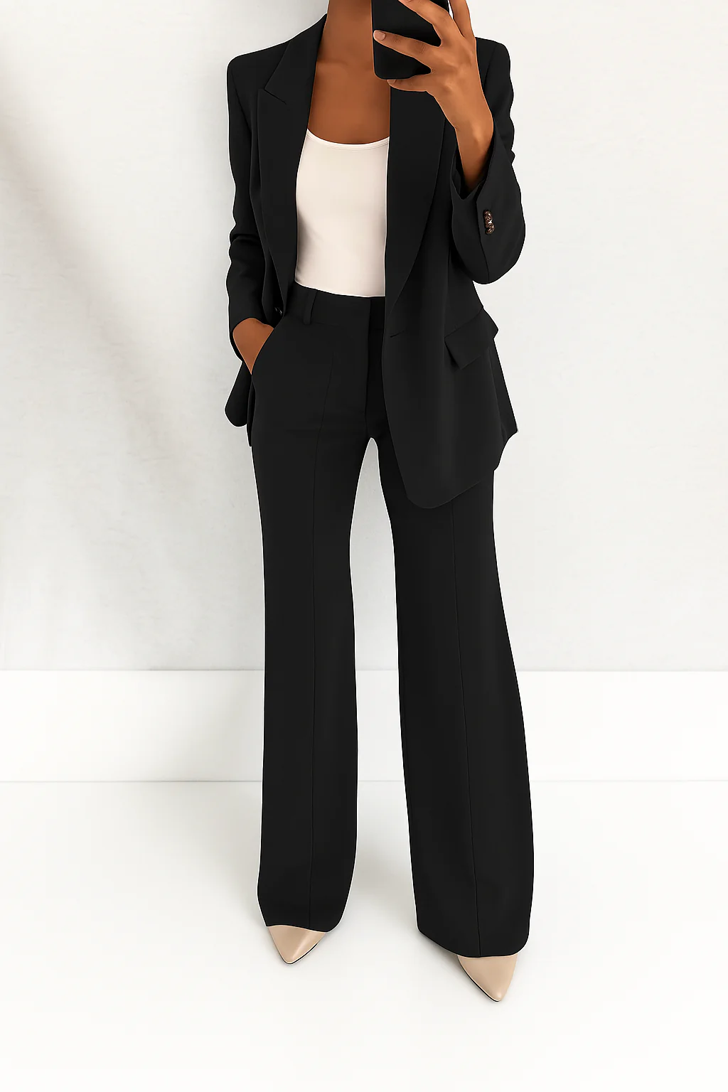 Formal women's suit set featuring a sophisticated blazer and comfortable trousers, suitable for professional women.