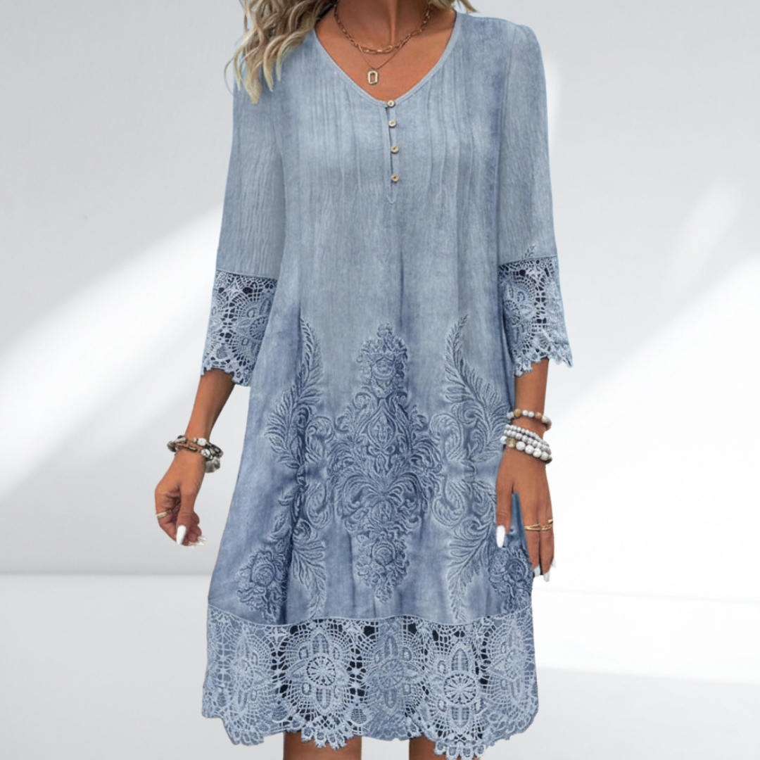 Women's embroidered A-line midi dress featuring a V-neck and 3/4 sleeves. Comfortable and elegant for any occasion.