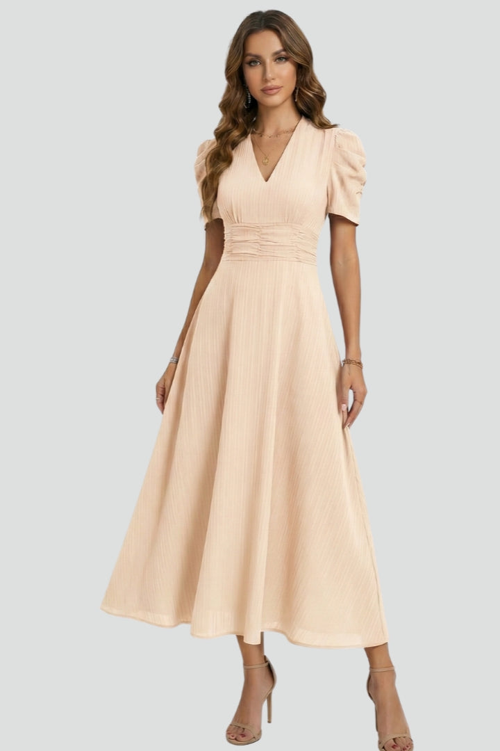 Sophisticated women's V-neck midi dress with short sleeves, ideal for casual outings or semi-formal spring events.