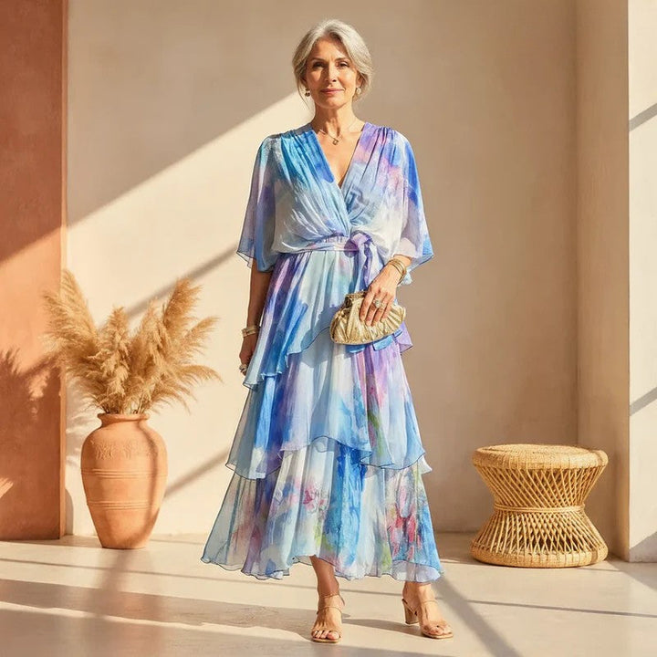 Elegant women's watercolor flowy maxi dress, perfect for summer parties & evening events. Long, vibrant design.