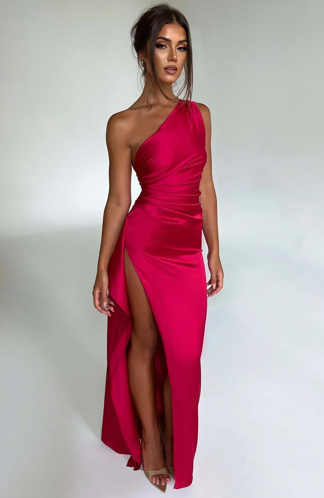 Elegant women's white asymmetric one-shoulder evening maxi dress with draped detailing, perfect for formal summer events.